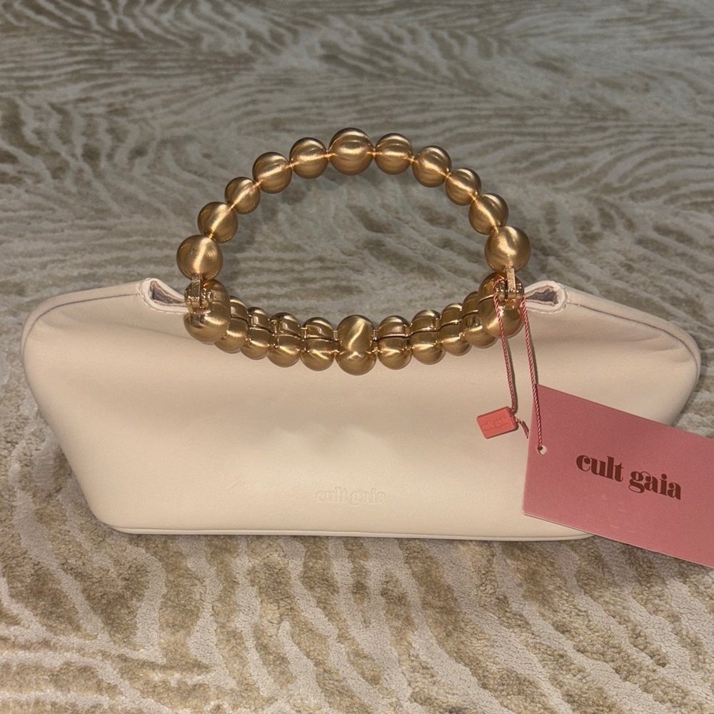 Cult Gaia Cream Clutch with Gold Beaded Handle. Tags attached